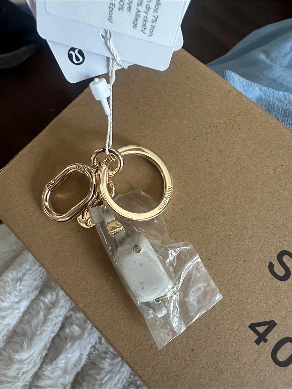 Everywhere belt bag charm keychain Gold Tone Key Ring Charm with Cream Accent